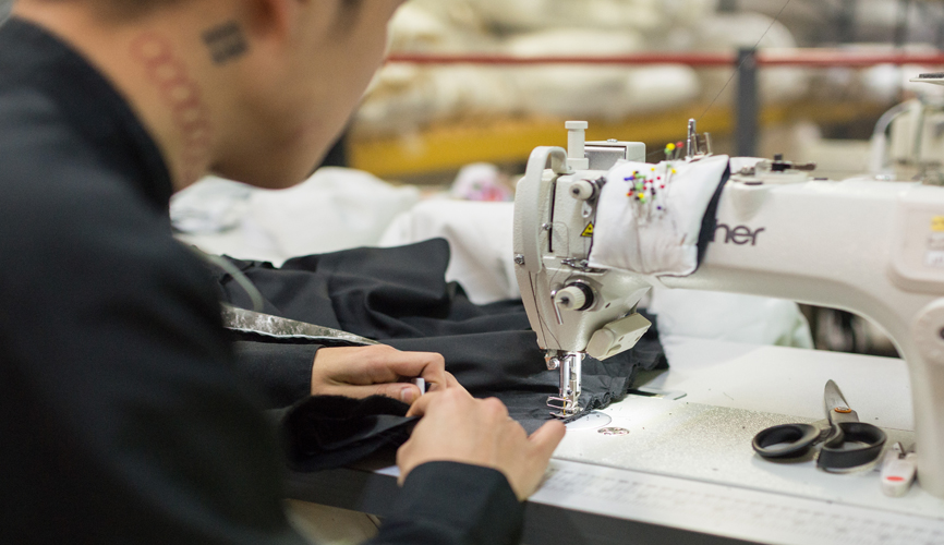 contrado worker at sewing machine